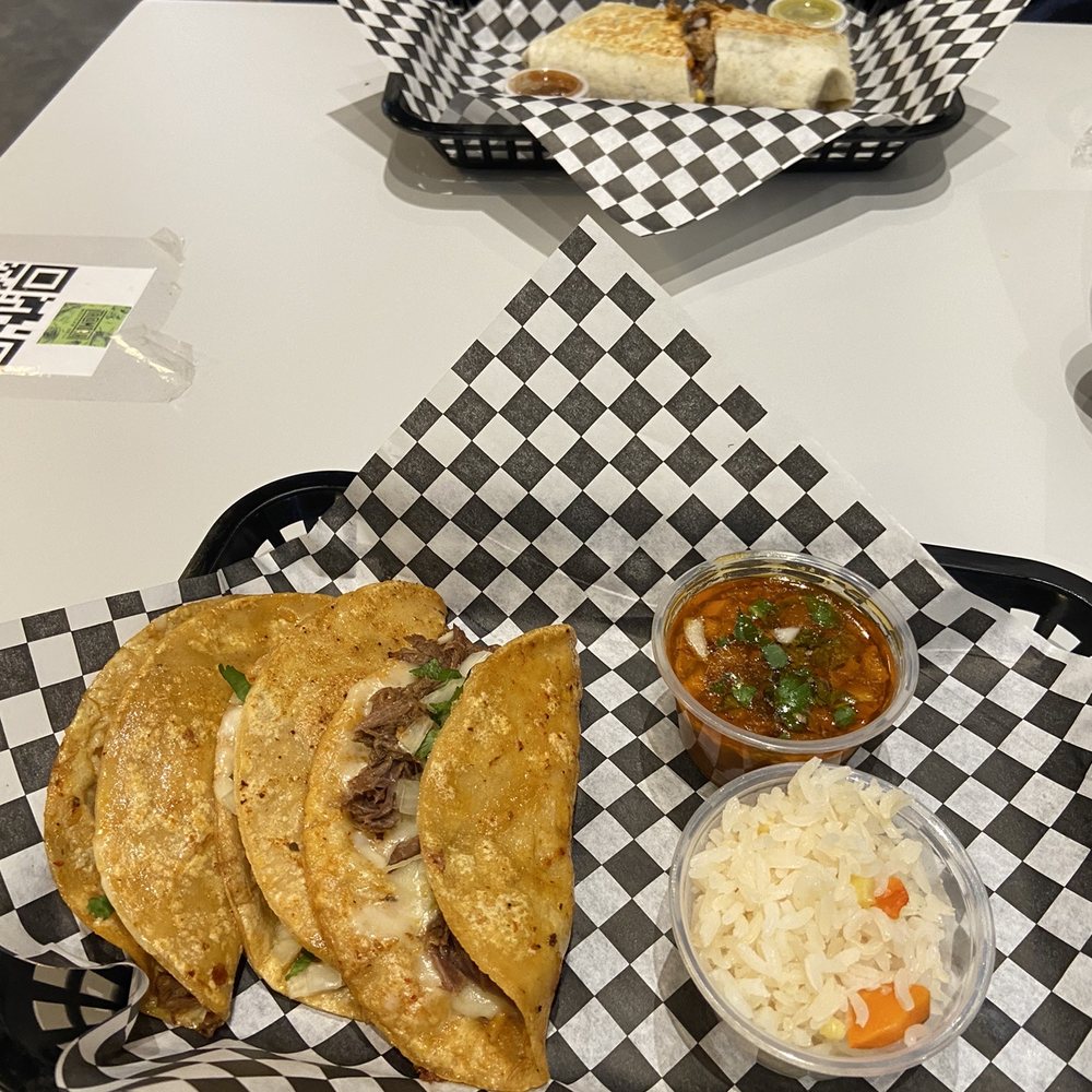 They serve dishes on trays! (Quesa Birria Tacos and a Carnitas Burrito) They serve dishes on trays! (Quesa Birria Tacos and a Carnitas Burrito)