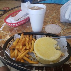 Pan Pan Bakery - Breakfast arepa, egg tomatoes green onions and cheese.