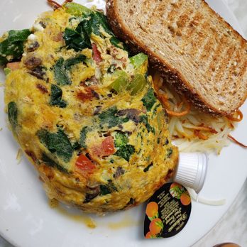 Meli Cafe - Vegetarian omelet with hall browns and wheat toast - omelet was delicious with nicely cooked veggies - New American Near Me - Chicago, Illinois Meli Cafe - Vegetarian omelet with hall browns and wheat toast - omelet was delicious with nicely cooked veggies - New American Near Me - Chicago, Illinois