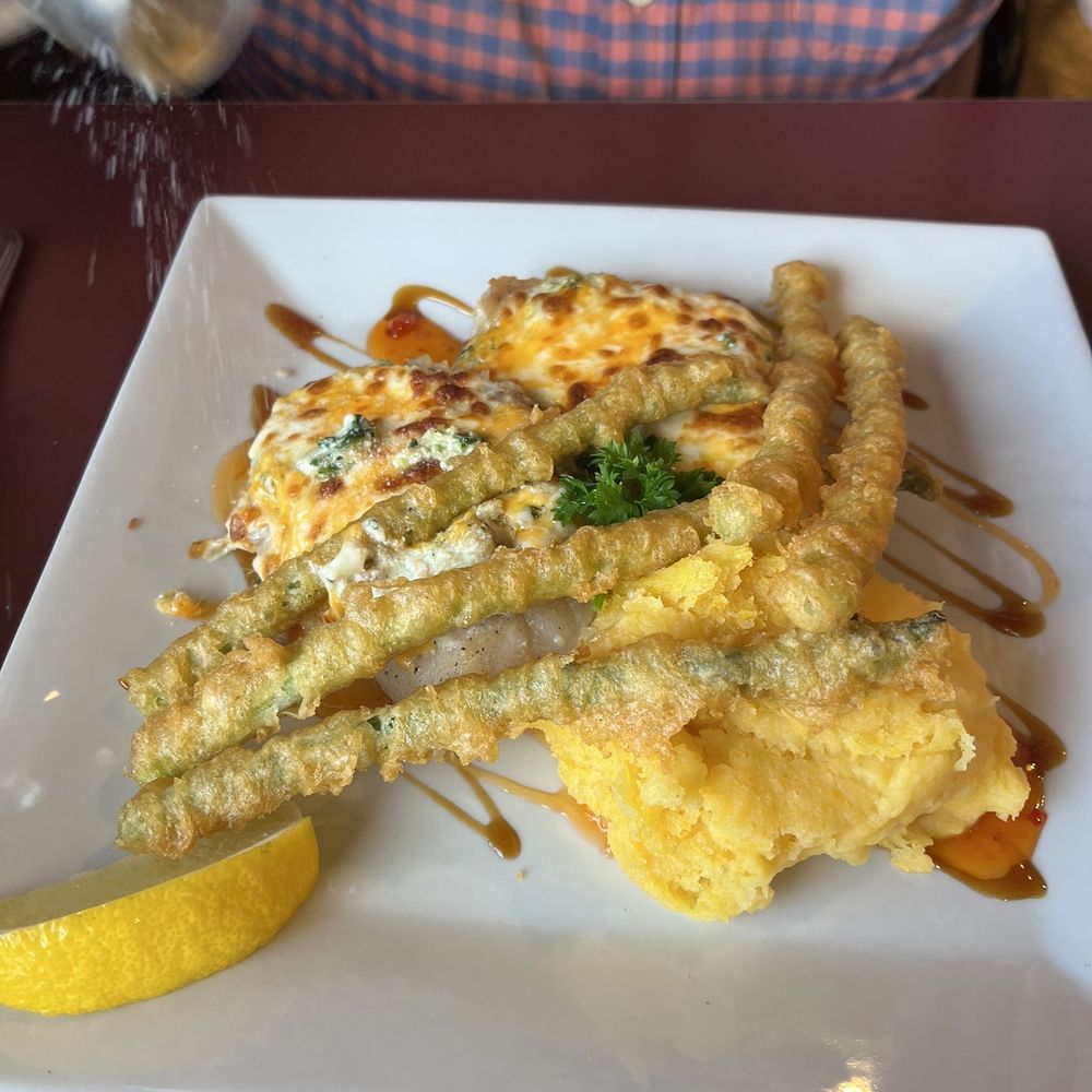 Aioli Seafood Restaurant - a person sprinkling salt on a dish - Seafood Near Me - Parksville, British Columbia Aioli Seafood Restaurant - a person sprinkling salt on a dish - Seafood Near Me - Parksville, British Columbia