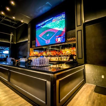 Ekko Lounge - a baseball stadium bar with a television in the background - Sports Bars Near Me - Dallas, Texas Ekko Lounge - a baseball stadium bar with a television in the background - Sports Bars Near Me - Dallas, Texas