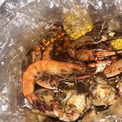 American Wings & Cajun Seafood - Blue crabs & shrimp head on with corn and potatoes