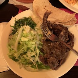 Barbacoa de Chivo with rice and beans on the side Barbacoa de Chivo with rice and beans on the side