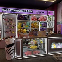 Neko Clawww - Buy tokens with card at the front or there's a machine you can buy with cash but doesn't provide change.
