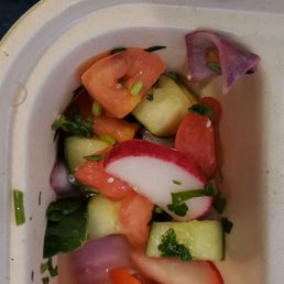 Mediterranean salad with vegetables cut to be the size of quarters.