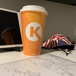 a cup of coffee on a desk