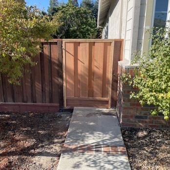 Agellon Fence Restoration - After.  New wood gate installed on a new post. 4x6 post cemented into the ground and tied into the house. It's not going anywhere. - Fences & Gates Near Me - Livermore, California