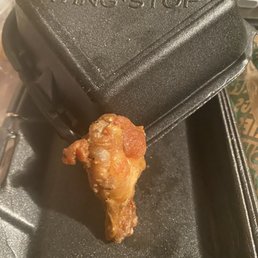 a fried chicken in a frying pan a fried chicken in a frying pan
