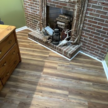 Fletcher Flooring - LVP in basement around fireplace - Flooring Near Me