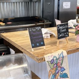a kitchen counter with a sign on it