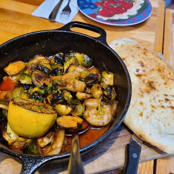 The Old Goat - Brussel Sprouts and Shrimp served with a side of homemade bread. - American Near Me - Grand Rapids, Michigan The Old Goat - Brussel Sprouts and Shrimp served with a side of homemade bread. - American Near Me - Grand Rapids, Michigan