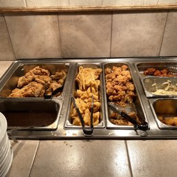 a buffet with a variety of food items a buffet with a variety of food items