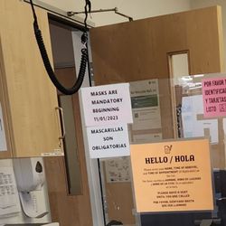 Marin Community Clinics - This sign is up, but no one working here is wearing a mask, and I'm the only patient wearing one.