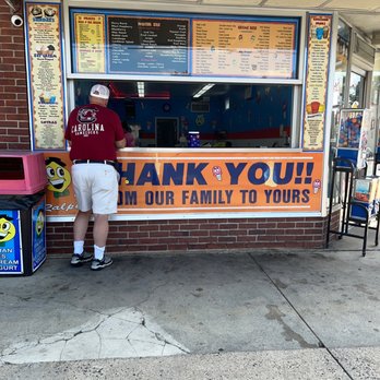 Ralph's Famous Italian Ices - a man standing in front of a window - Ice Cream & Frozen Yogurt Near Me - Oceanside, New York Ralph's Famous Italian Ices - a man standing in front of a window - Ice Cream & Frozen Yogurt Near Me - Oceanside, New York