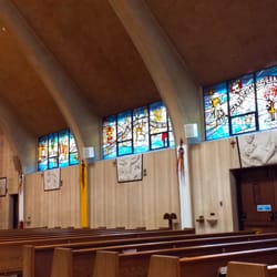 Holy Family Church - Pews and stained glass windows