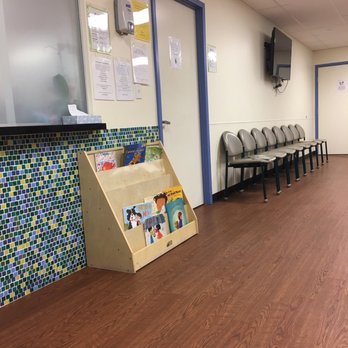 Houston Specialty Clinic - Books for kids, one row of seats. - Pediatricians Near Me - Houston, Texas