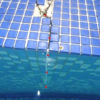 Pool Problems - Pool resurfacing service. Crack in the spillway between hot tub and pool. This is due to shifting ground in our valley. This can be repaired - Pool & Hot Tub Service Near Me - Coachella, California