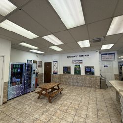 SuperSuds Laundromat - Currency station and vending area