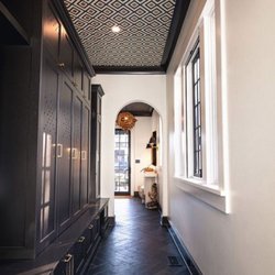 Costili Cabinetry - Tall and dark lockers for the win here. Check out those door cutouts for air ventilations.