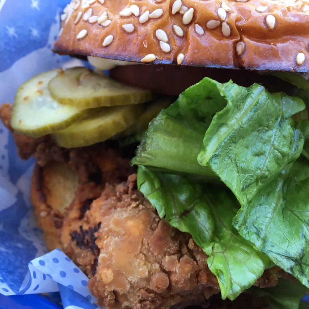 Dollop Diner - Fried chicken sandwich, $8: breaded chicken, sweet pickle, heirloom tomato slice, lettuce and mayonnaise on a sesame-potato bun. - Breakfast & Brunch Near Me - Chicago, Illinois
