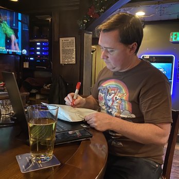 Wild Corgi Pub - Owner handwriting packages of t-shirts to past patrons - Pubs Near Me - Denver, Colorado Wild Corgi Pub - Owner handwriting packages of t-shirts to past patrons - Pubs Near Me - Denver, Colorado