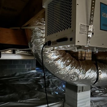 Mold Patrol - A 60 lb dehumidifier hanging w/ plumber's strap, plugged into an extension cord and running constantly in an unsealed crawlspace - Damage Restoration Near Me - Burlington, North Carolina Mold Patrol - A 60 lb dehumidifier hanging w/ plumber's strap, plugged into an extension cord and running constantly in an unsealed crawlspace - Damage Restoration Near Me - Burlington, North Carolina