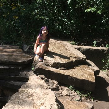 Waterfall Glen Forest Preserve - My daughter on the rocks by the waterfall - Parks Near Me - Darien, Illinois Waterfall Glen Forest Preserve - My daughter on the rocks by the waterfall - Parks Near Me - Darien, Illinois