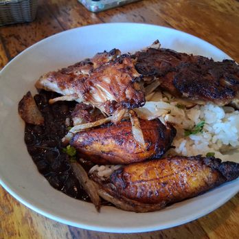 Guava's Cuban Cafe - Lechon asado rice bowl ($16): delicious roast pork, black beans, rice, and maduros (sweet plantain) - Cuban Near Me - Minneapolis, Minnesota