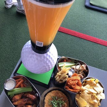 Topgolf - New Belgium IPA beer tower, buffalo wings, garlic parmesan wings, buffalo chicken dip, side of fries and sweet potato waffle fries - Golf Near Me - Las Vegas, Nevada