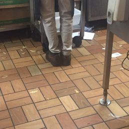 a person standing in a kitchen a person standing in a kitchen