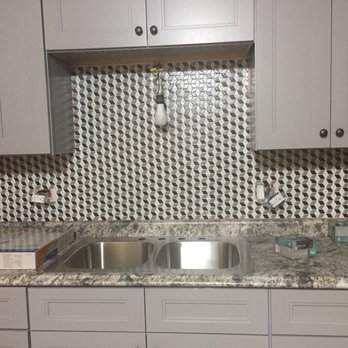 General Contractors Solutions - a kitchen with a sink and cabinets - General Contractors Near Me - Chicago, Illinois