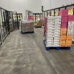 BJ's Wholesale Club - These pallets of milk were sitting out and the refrigerator doors open before I arrived and after I left.