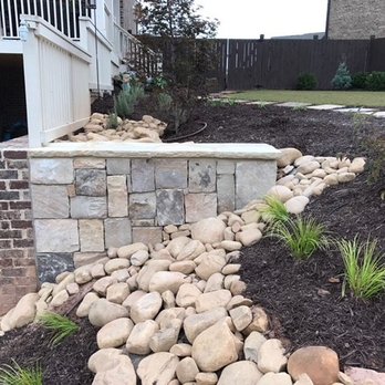 Terra Designs and Creations - a garden with a stone wall - Landscaping Near Me - Buford, Georgia Terra Designs and Creations - a garden with a stone wall - Landscaping Near Me - Buford, Georgia
