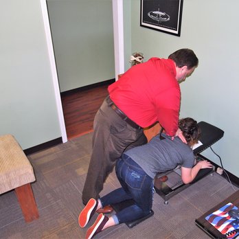 Anderson Upper Cervical - Dr. Patrick Anderson DC adjusting a patient using Upper Cervical Specific Knee Chest technique - Chiropractors Near Me - Dallas, Georgia Anderson Upper Cervical - Dr. Patrick Anderson DC adjusting a patient using Upper Cervical Specific Knee Chest technique - Chiropractors Near Me - Dallas, Georgia