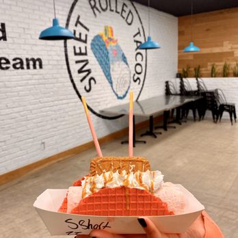 Sweet Rolled Tacos - a hand holding a waffle cone - Ice Cream & Frozen Yogurt Near Me - St. George, Utah Sweet Rolled Tacos - a hand holding a waffle cone - Ice Cream & Frozen Yogurt Near Me - St. George, Utah
