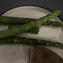 The 4 pieces of asparagus we received for a $2 up charge. Plain steamed, no oil or seasonings. The 4 pieces of asparagus we received for a $2 up charge. Plain steamed, no oil or seasonings.