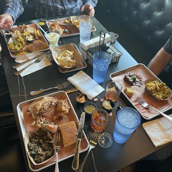 Lil Pig Lil Pig - We ordered items to share with cocktails! Pulled pork sandwich, collard greens, tallow fries, lil pig burger, pork belly, and banana pudding - Barbeque Near Me - Vancouver, Washington