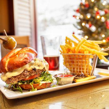 Aurora Bar and Grill - RR Ranch American Kobe Burger $16 +$2 Mushrooms +$1 Provolone  "half-pound patty, lettuce, tomato, onion on a pretzel bun" - New American Near Me - Girdwood, Alaska