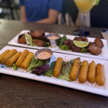 Gandules Grill - two plates of food on a table - Puerto Rican Near Me - Lehigh Acres, Florida