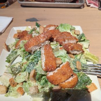 Guy Fieri's Kitchen + Bar - Caesar salad with chicken added - American Near Me - Council Bluffs, Iowa Guy Fieri's Kitchen + Bar - Caesar salad with chicken added - American Near Me - Council Bluffs, Iowa