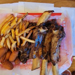 King platter beef ribs with fries and hush puppies King platter beef ribs with fries and hush puppies