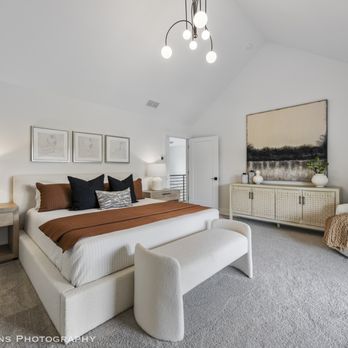 DJK Custom Homes - Spacious and light-filled primary bedroom designed as a calming retreat, featuring soft neutral tones and layered textures. - General Contractors Near Me - Naperville, Illinois