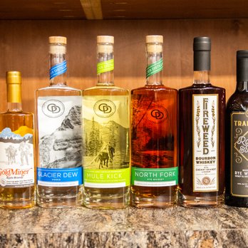 Flathead Liquor - a variety of bottles on a counter - Casinos Near Me - Kalispell, Montana
