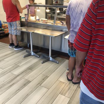 Beijing Express - a group of people standing around a counter - Chinese Near Me - La Mesa, California