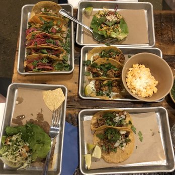 Bartaco Hilldale - Table set up with lots of tacos and street corn. - Tacos Near Me - Madison, Wisconsin Bartaco Hilldale - Table set up with lots of tacos and street corn. - Tacos Near Me - Madison, Wisconsin