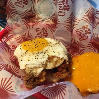 Cabin 82 - Spicy chicken biscuit with cheese and egg! Sooo good!! - Cafes Near Me - Oxford, Mississippi