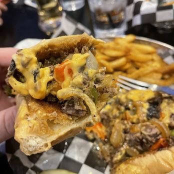 ESPN BET - a hand holding a half eaten sandwich - Sports Bars Near Me - Council Bluffs, Iowa ESPN BET - a hand holding a half eaten sandwich - Sports Bars Near Me - Council Bluffs, Iowa