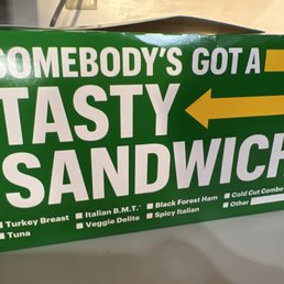 a box of tasty sandwich on a table a box of tasty sandwich on a table