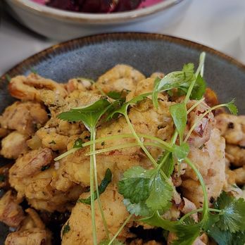 Joon - Fried pawns and calamari over spicy sauce Background is the Beet spread which was really good - Persian/Iranian Near Me - Vienna, Virginia Joon - Fried pawns and calamari over spicy sauce Background is the Beet spread which was really good - Persian/Iranian Near Me - Vienna, Virginia