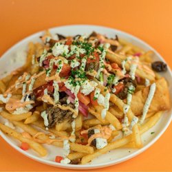 The Zeus at Santorini's Sandy: Fries topped with gyro meat, feta, and Doner Aioli. A favorite at The Commons at Southtowne!